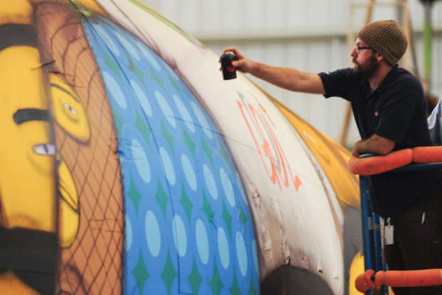 os-gemeos-spray-paint-the-brazillian-national-teams-airplane-7