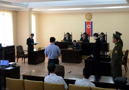 U.S. citizen Matthew Todd Miller  stands in a witness box during his trial at the North Korean Supreme Court