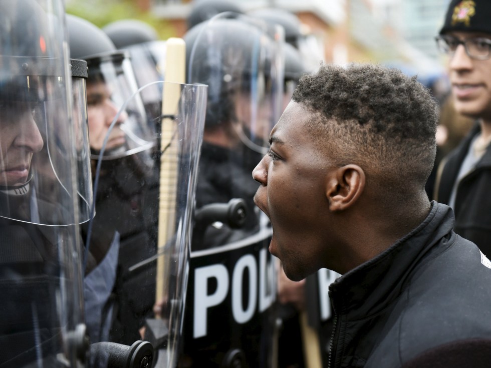Image: A demonstrator confronts police near Camden Yards during a protest against the death in police custody of Freddie Gray in Baltimore